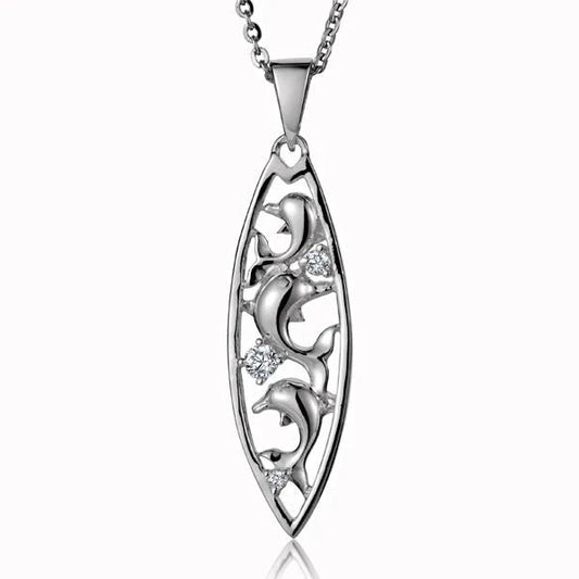 Sterling silver dolphin and surfboard pendant with cubic zirconia accents, designed by Ashley's Gift Shop.