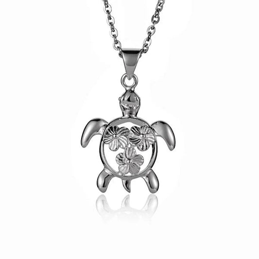 Three hibiscus and honu pendant necklaces featuring floral and turtle designs, crafted by Ashley's Gift Shop.