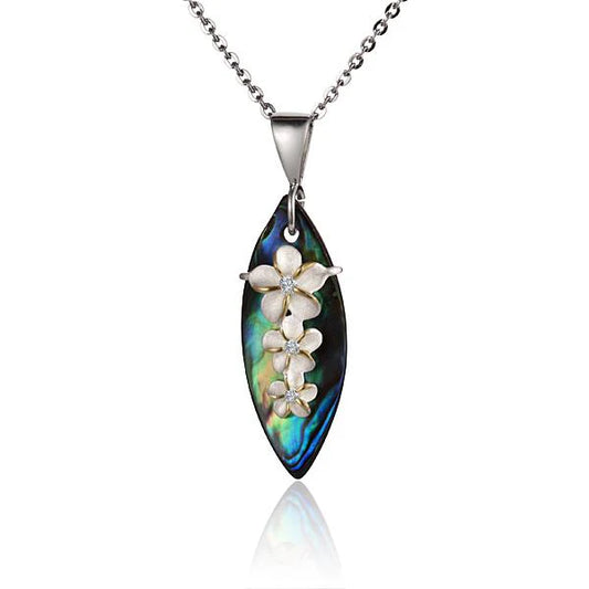 Three Plumeria Aba surfboard pendants in vibrant colors, showcasing detailed design and tropical floral motifs.