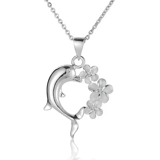 Three sterling silver Plumeria heart dolphin pendants with intricate detailing, perfect for jewelry or gift accessories.