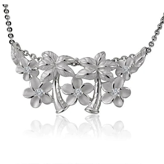 Sterling silver 5 Plumeria and 3 palm tree pendant, handcrafted jewelry with detailed floral and tree designs.