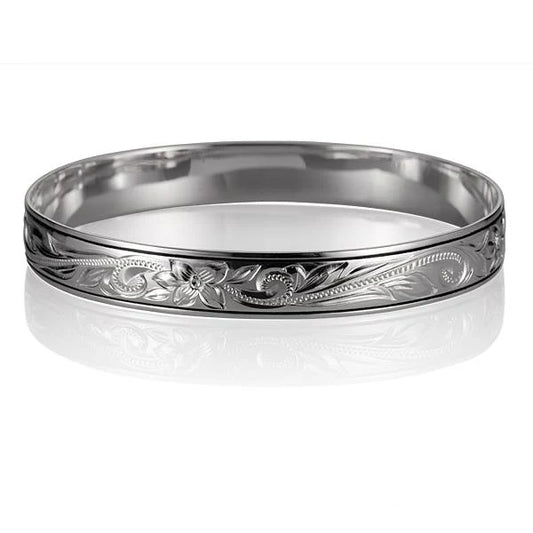 Hawaiian Scroll Bangle 10mm by Ashley's Gift Shop, showcasing intricate metalwork and traditional Polynesian design in a close-up shot.
