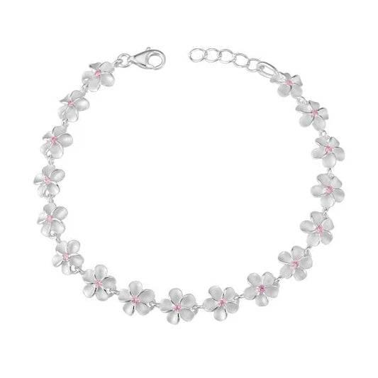 Pink CZ bracelet with 6mm plumeria-shaped beads from Ashley's Gift Shop, featuring sparkling cubic zirconia accents.
