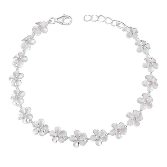 Pink CZ bracelet with 8mm plumeria-shaped beads from Ashley's Gift Shop, stylish jewelry accessory.