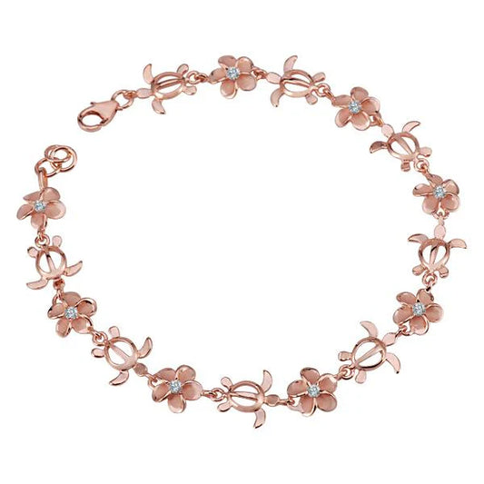 Ashley’s Gift Shop Plumeria CZ Honu-Dolphin plated bracelet with 8mm beads featuring dolphin and plumeria flower designs.
