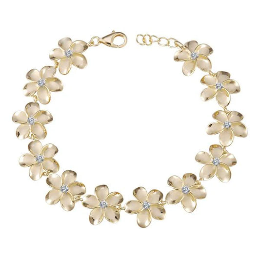 Gold-plated Plumeria CZ bracelet with 15mm charms, featuring floral design and adjustable chain, by Ashley's Gift Shop.