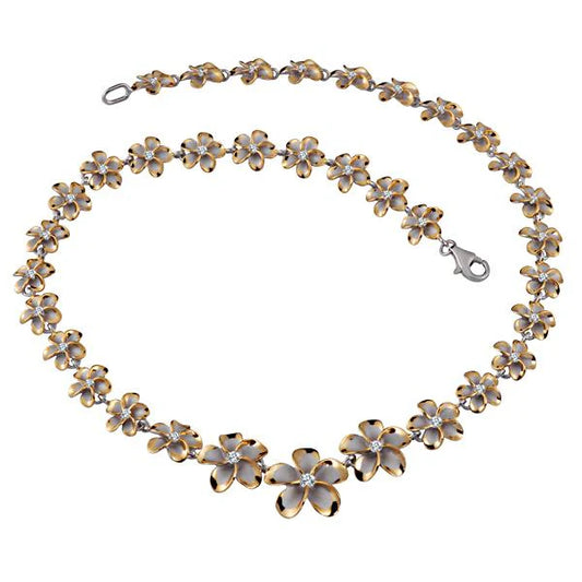 Yellow Plumeria 2-tone necklace with 10-18mm beads from Rhoidum, styled with a delicate chain and floral accents.