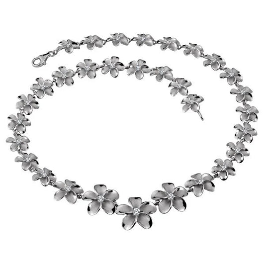 Rhodium-plated Plumeria necklace with 12-20mm beads, showcasing a delicate floral design on a silver chain.