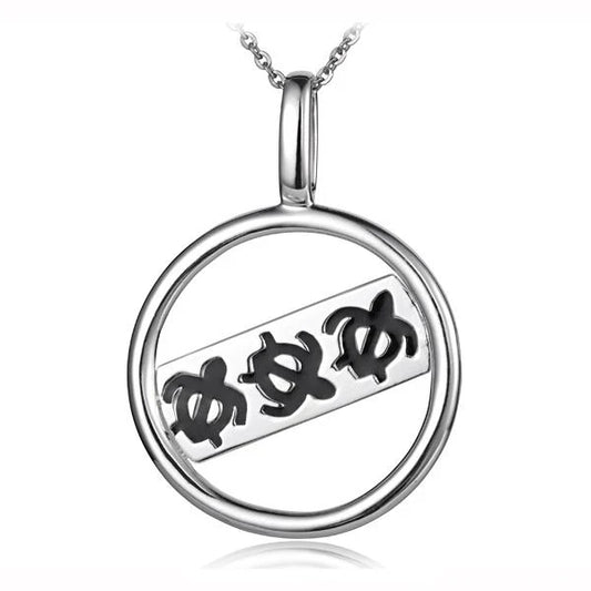 Black honu pendant featuring a circle design, crafted by Ashley's Gift Shop, shown in this detailed close-up image.
