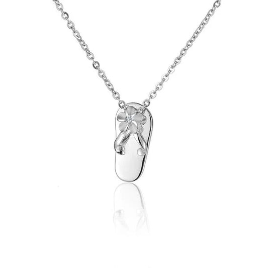 Small Plumeria Slipper Pendant from Ashley's Gift Shop featuring a delicate floral design on a silver-toned pendant.