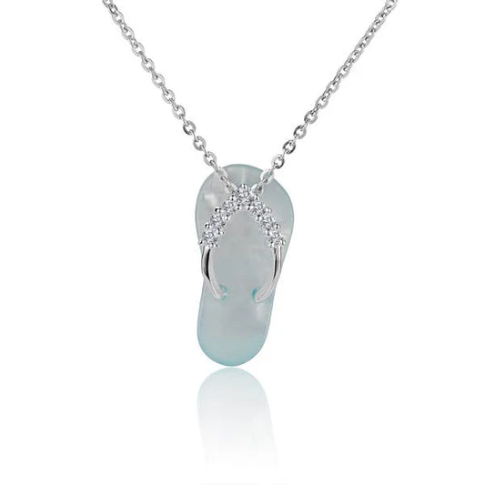 Plumeria 7CZ Shell Slipper Pendant featuring sparkling cubic zirconia and shell accents, designed by Ashley's Gift Shop.