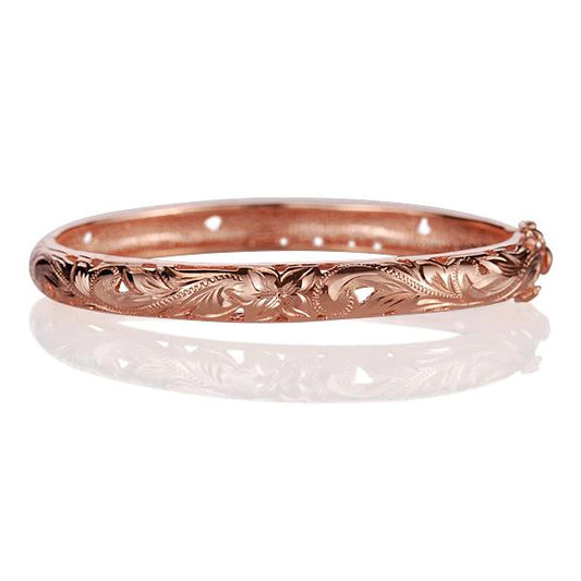 Pink gold plated oval sterling silver bangle with scroll design, crafted from 925 sterling silver, by Ashley's Gift Shop.