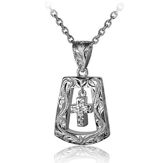 Trapezoid-shaped cross pendant in silver with detailed design, hanging on a delicate chain.