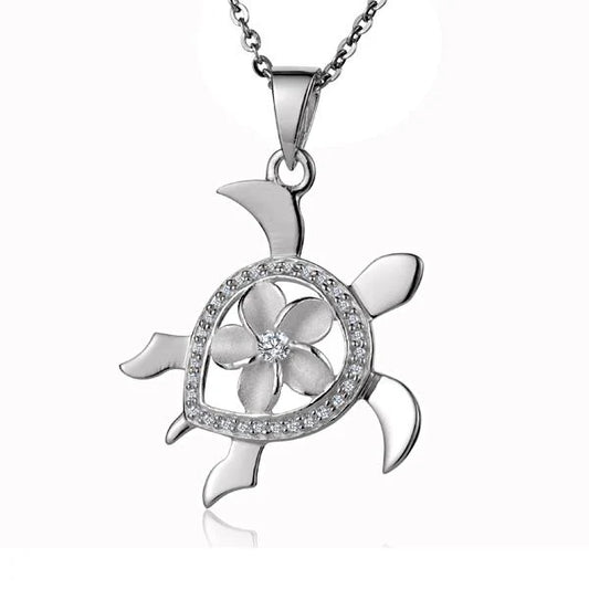 925 silver CZ Honu Plumeria pendant featuring a Hawaiian turtle and flower design, crafted with sparkling cubic zirconia accents.