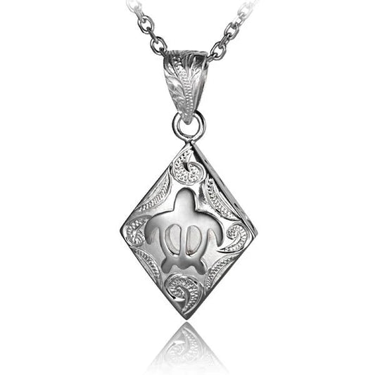 Diamond Honu scroll pendant featuring a turtle design with sparkling diamonds, crafted by Ashley's Gift Shop.