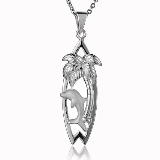 Sterling silver dolphin and palm tree surfboard pendant with detailed ocean and tropical design, ideal for beach jewelry lovers.