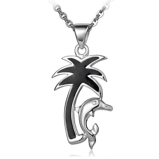Colorful enamel palm tree with dolphin pendant, handcrafted jewelry piece with tropical design and silver accents.
