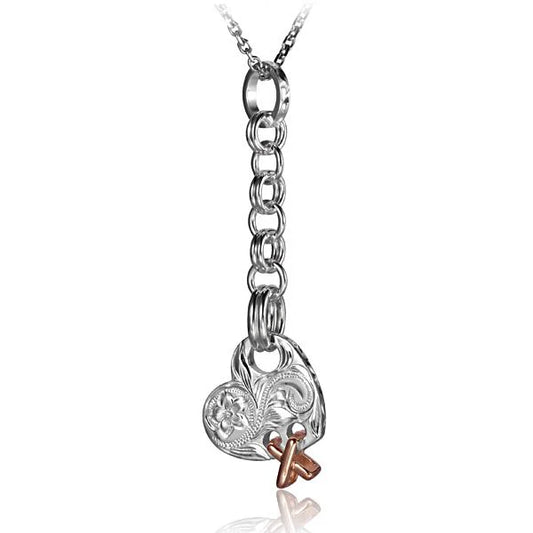 Engraved heart cross dangling pendant in silver, featuring intricate design, from Ashley's Gift Shop.