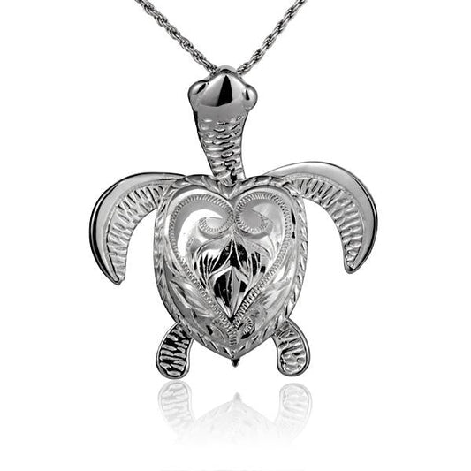 Large engraved turtle pendant in silver-tone metal, featuring detailed turtle design, from Ashley's Gift Shop.