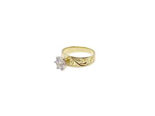 Hawaiian 14K Gold ring with a sparkling diamond, elegant jewelry piece.