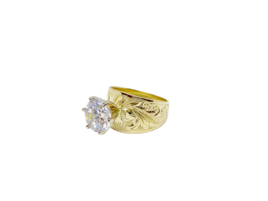 Hawaiian 14K Gold jewelry with tribal design, detailed view.