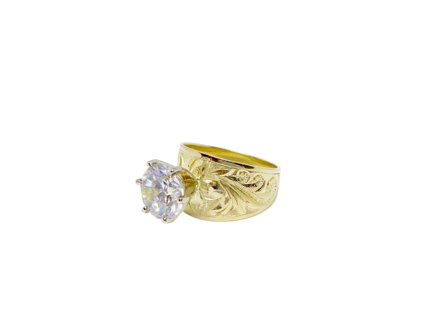Hawaiian 14K Gold jewelry with tribal design, detailed view.