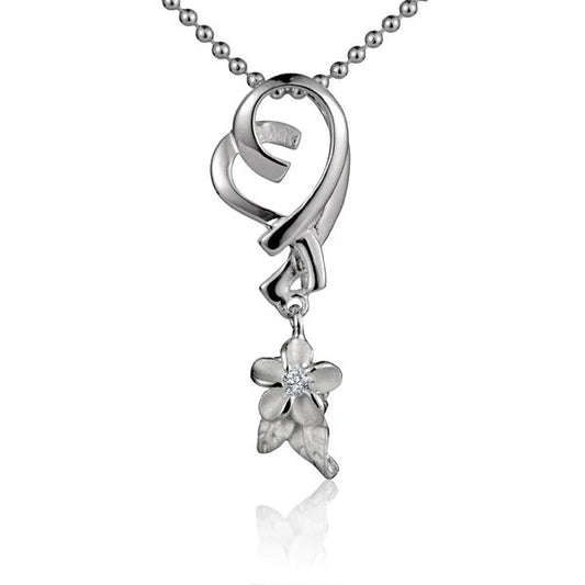 Heart-shaped Plumeria pendant in silver with floral details, designed by Ashley's Gift Shop.