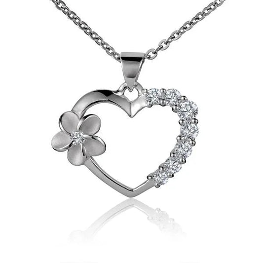 Sterling silver Heart Plumeria pendant with side CZ stones, rhodium finish, handcrafted jewelry designed for elegant style.
