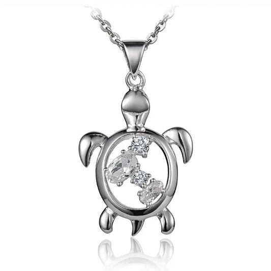 Silver Honu 4 CZ pendant featuring a turtle design, crafted by Ashley's Gift Shop, with sparkling cubic zirconia accents.