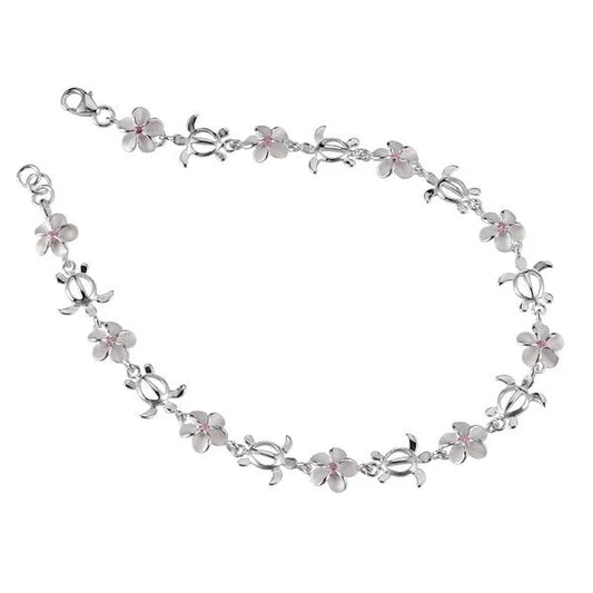 Pink CZ anklet featuring honu and plumeria charms, crafted by Ashley's Gift Shop, displayed on a white background.