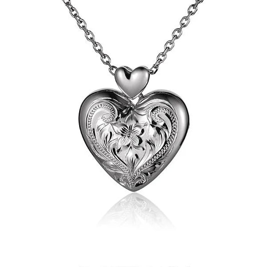 Large locket pendant from Ashley's Gift Shop with intricate design and openable front, perfect for keepsakes or photos.