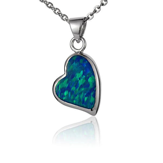 Sterling silver opal heart pendant with vibrant blue and green hues, showcasing a polished, elegant jewelry piece.