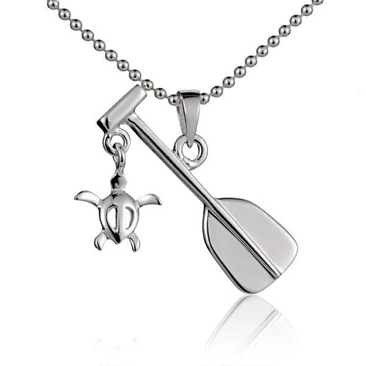 Honua-shaped pendant on a necklace, designed in a paddle style, from Ashley's Gift Shop.