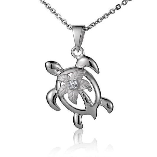 Sterling silver Palm Tree Honu pendant featuring a turtle and palm tree design, crafted by Ashley's Gift Shop.