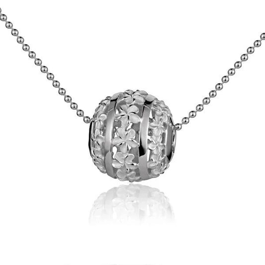 Sterling silver Plumeria Ball Pendant featuring intricate floral design, perfect for elegant jewelry accessories.