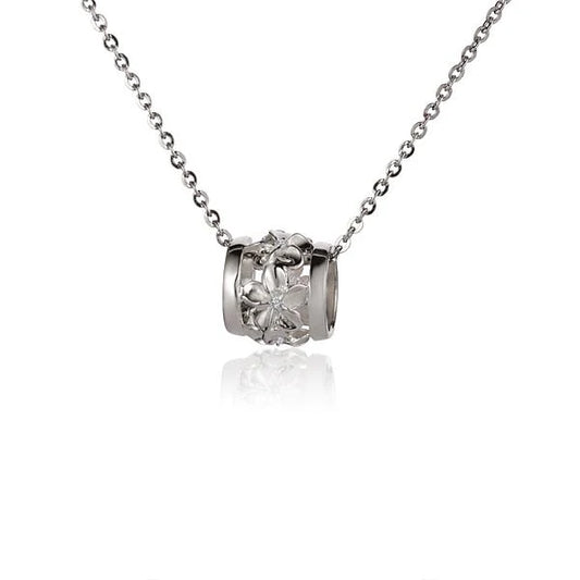 Plumeria Barrel CZ pendant in medium size featuring sparkling cubic zirconia, styled on a silver chain.