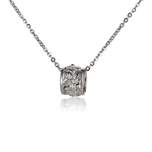 Plumeria Barrel Pendant necklace in medium size with floral design, from Ashley's Gift Shop, close-up view of the pendant.