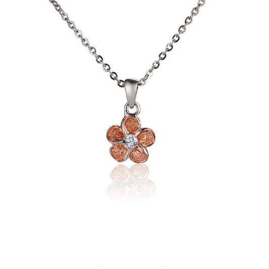 10mm Plumeria Raised Sand PG pendant by Ashley's Gift Shop, featuring a detailed floral design on a polished pendant.
