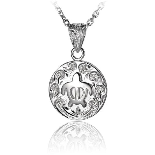 Round Honu Scroll pendant featuring a turtle design, crafted by Ashley's Gift Shop, displayed on a chain.