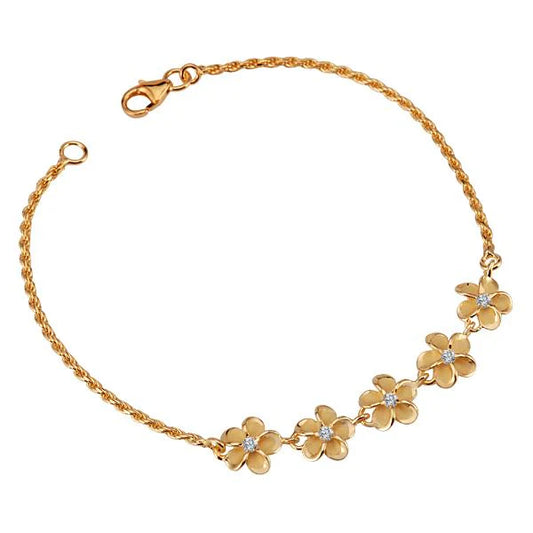 Sterling silver five plumeria CZ rope bracelet with 8mm beads, featuring yellow gold plating, on a neutral background.