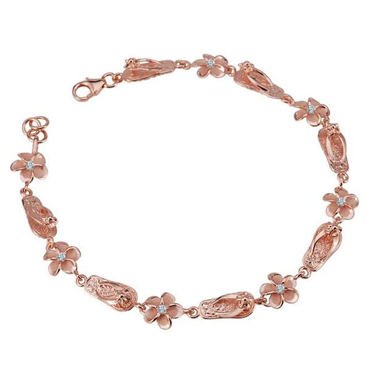 Sterling silver Plumeria CZ bracelet with 8mm beads, plated in rose gold, featuring floral design and adjustable chain.