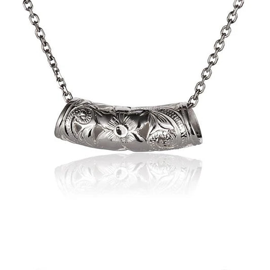 Large scroll C/O pendant from Ashley's Gift Shop featuring intricate design, hanging chain, and antique-style craftsmanship.