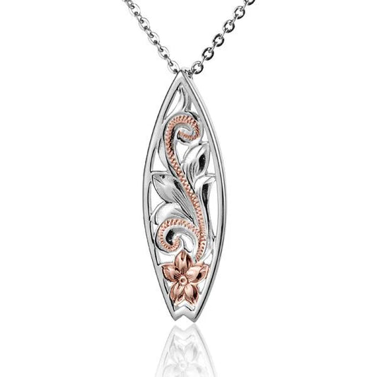 Ashley’s Gift Shop Scroll C/O Surfboard 2T Pendant featuring a detailed surfboard design on a pendant necklace.
