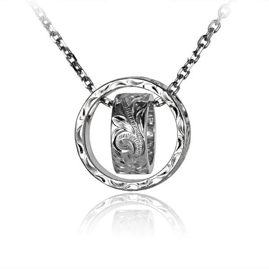 Elegant scroll circle and ring pendant necklace from Ashley's Gift Shop, featuring intricate metalwork and a delicate design.