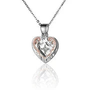 Sterling silver Scroll Double Heart PG necklace with rhodium plating, featuring intricate heart-shaped design and elegant craftsmanship.