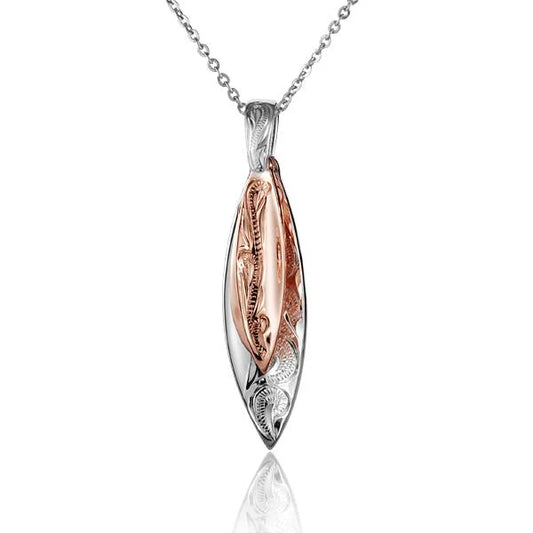 Scroll double surfboard pendant jewelry featuring two surfboard charms with intricate scroll detailing, crafted by Ashley's Gift Shop.