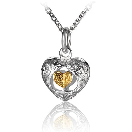 3D scroll heart pendant in silver with intricate engraved details, crafted by Ashley's Gift Shop, shown on a plain background.