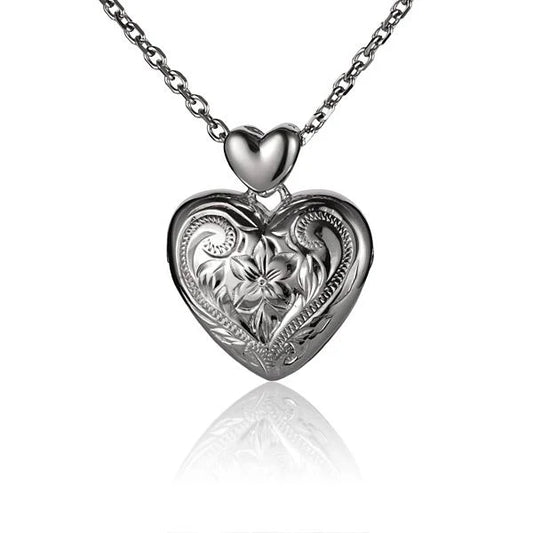 Small scroll heart locket pendant from Ashley's Gift Shop with intricate design and clasp, perfect for jewelry collection.
