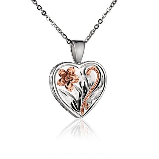 Gold scroll heart pendant with intricate detailing, stylish jewelry piece from Ashley's Gift Shop.