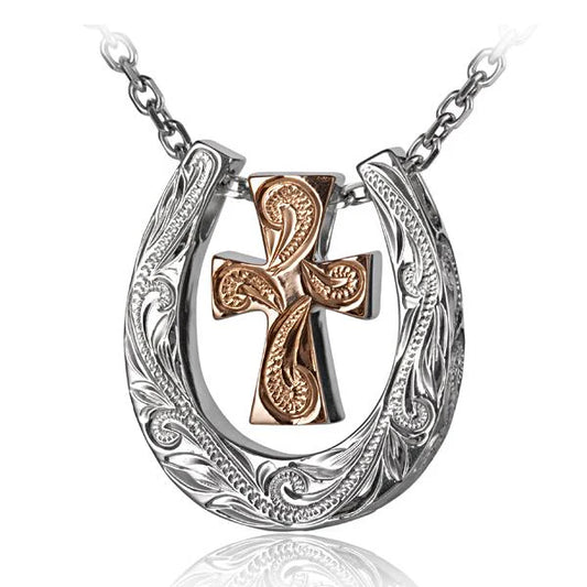 Scroll horse shoe and cross pendant, gold-tone jewelry with intricate detailing, featuring a horse shoe and cross design.